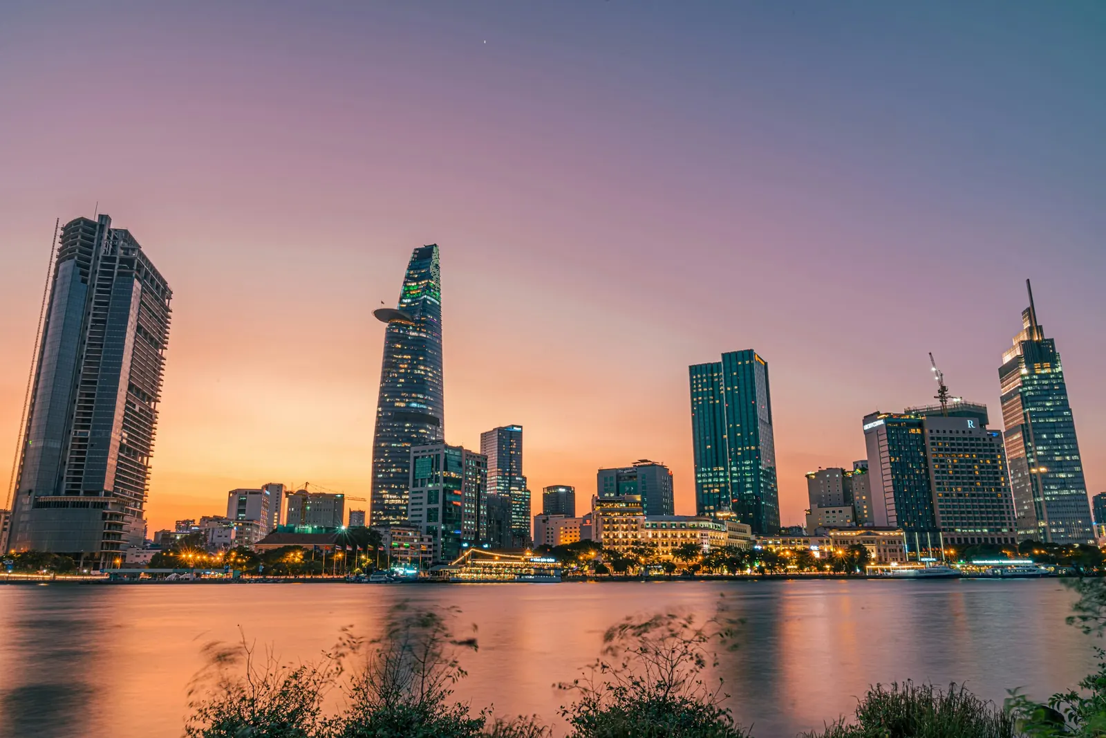 The Ho Chi Minh City skyline over the Saigon River at sunset